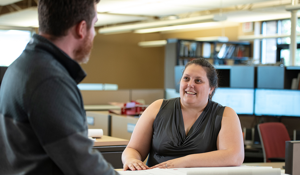 Photo of two people in an office setting