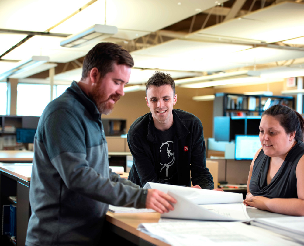 group of people discussing architecture