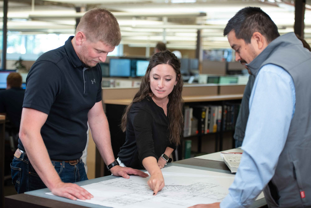 group of people discussing architecture